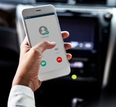 woman-using-mobile-while-car 1