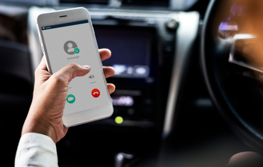 woman-using-mobile-while-car 1
